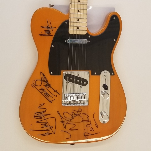 Close shot of all 5 Rolling Stones signatures on Squier Bullet